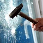 Smashing security glass with hammer